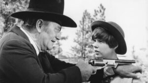 True-Grit-John-Wayne-as-Rooster-Cogburn-and-Kim-Darby-as-Mattie-Ross-678x381-1.jpg