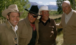 Glen-Cambell-with-John-Wayne-True-Grit-producer-Hal-Wallis-and-director-Hal-Hathaway-4140328.png