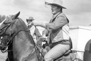 john-wayne-credits-his-iconic-cowboy-persona-wyatt-earp-heres-why-585x390-1.jpg